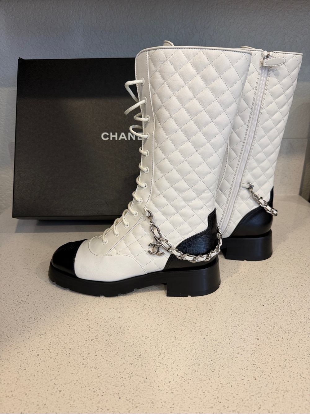 CHANEL White Quilted Leather Lace-Up Combat Boots with Black Cap Toe & Chain